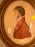 Framed Oval Format Watercolor Portrait of a Gentleman in a Red Jacket