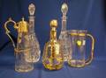 Five Silver Mounted and Colorless Glass Cruets and Decanters