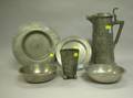 Two Pewter Plates Two Basins a Flagon and a Beaker