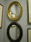 Four Oval Framed Mirrors