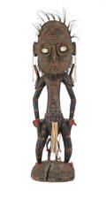 South Pacific carved figure with conch shell eyes