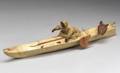 Inuit Hide and Wood Kayak with Paddler