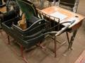 Childs School Desk Windsor Rodback Side Chair Wooden Mortar and Pestle Pair of Indian Clubs and a Painted Wood Push Sleigh
