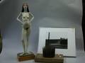 Flaxickle Nail on Board Sculpture a Nude Female Plaster Figure and a John Eide Photograph