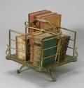 Revolving Brass and Oak Book Stand with Decorative Bindings