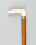 Carved ivory hound handle cane with gold band