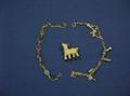 14kt Gold Lamb Brooch a Gold Charm Bracelet and a Scarab Bracelet