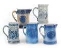 Five stoneware pitchers
