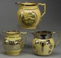 Three Yellow Glazed Earthenware Jugs