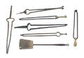 Six wrought iron fireplace tongs