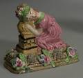 Enamel Decorated Earthenware Figure of a Young Girl