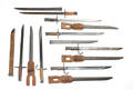 Group of seven Japanese bayonets and scabbards