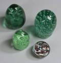 Four Glass Paperweights