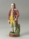 Polychrome Enamel and Pink Lustre Staffordshire Pottery Figure of Benjamin Franklin