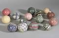 Collection of Fifteen Ceramic Carpet Balls