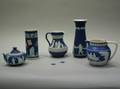Six Pieces of Wedgwood Blue Jasperware and a Copeland Pitcher