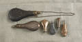Two black powder hunting flasks and four small priming flasks