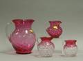 Four Cranberry Glass Pitchers