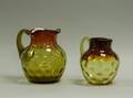 Two Amberina Glass Pitchers