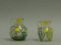 Two French Enameled Crackle Glass Pitchers