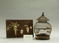 Japanese Ivory Mounted Lacquer Panel a Chinese Wood Birdcage and a Syroco Chrysanthemum Panel