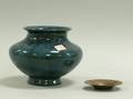 Small Hammered Copper Dish and a Blue Glazed Pottery Vase
