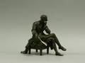 Bronze Figure of a Seated Gentleman