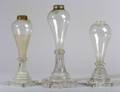 Three Colorless Freeblown and Pressed Glass Fluid Lamps