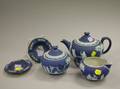 Wedgwood Dark Blue Jasper ThreePiece Tea Set and Two Ashtrays