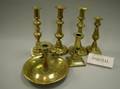 Nineteen Brass Candlesticks