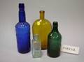 Large Lot of Colored and Colorless Glass Bottles