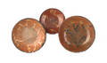 Three redware plates with yellow slip decoration