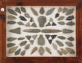 Framed display of fiftysix arrowheads
