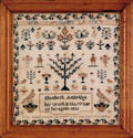 Silk on linen sampler with human figures