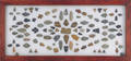 Framed collection of arrowheads