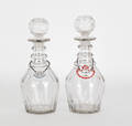 Pair of clear glass decanters with  Whiskey  and  Claret  labels