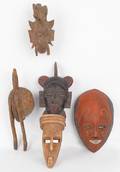 Five carved African masks