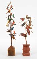 Two carved and painted bird trees