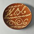 Redware Plate with Yellow Slip Inscription HBC