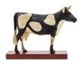 A Carved and Painted Wood Figure of a Cow