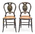 A Pair of Victorian Black Lacquered Painted and MotherofPearl Inlaid Balloon Back Side Chairs