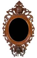 A Victorian Carved Walnut Mirror