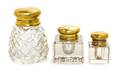 A Group of Three Brass Mounted Glass Inkwells