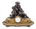 A Napoleon III Gilt and Patinated Bronze Figural Mantel Clock