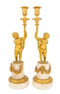 A Pair of Louis XVI Style Gilt Bronze and Marble Figural Candlesticks