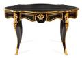 A Louis XV Style Gilt Bronze Mounted Ebonized Bureau Plat