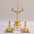 Near Pair of Brass Candlesticks and a Brass Twolight Candelabra