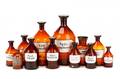 Collection of 12 Amber Glass Apothecary Bottles