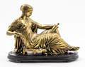 A Bronze Figure of a Woman Reclining
