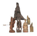 Six southeastern Asian carved wood and stone figures